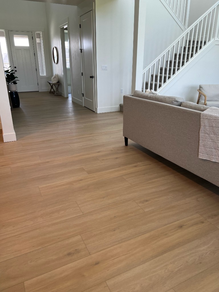 Luxury vinyl plank flooring installed in a kitchen—water-resistant wood-look LVP from Kraft Floors & Interiors