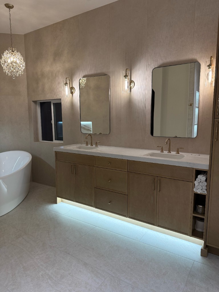 Luxury bathroom remodel with marble vanity and freestanding tub
